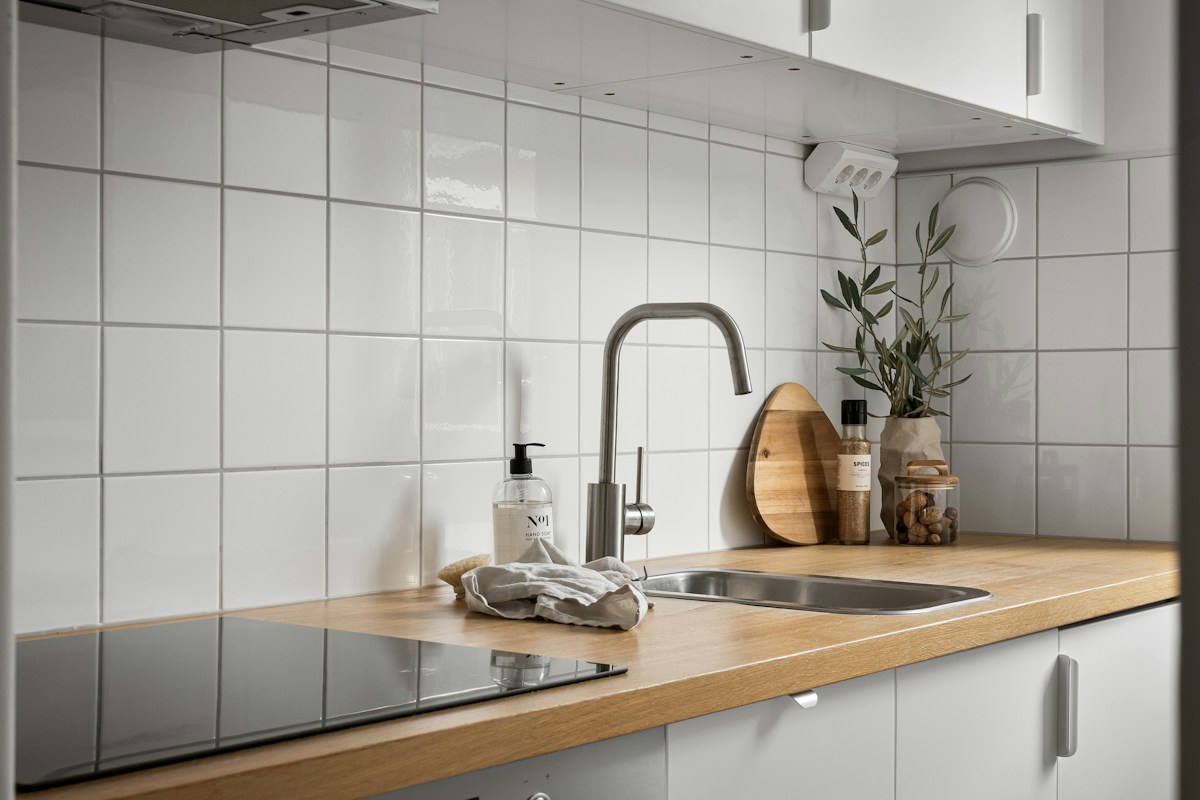 A kitchen benchtop and sink area